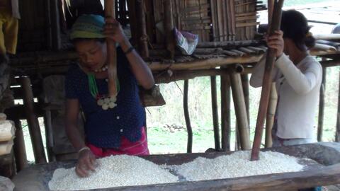 Women grinding corn